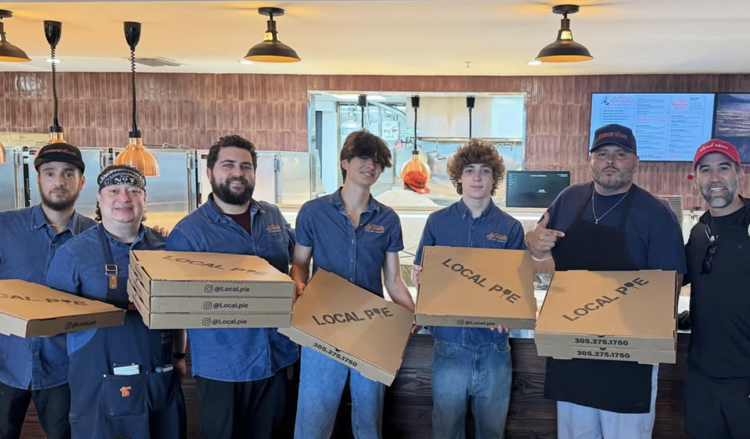 Local Pie team delivering pizzas to Arbetter's Hot Dogs
